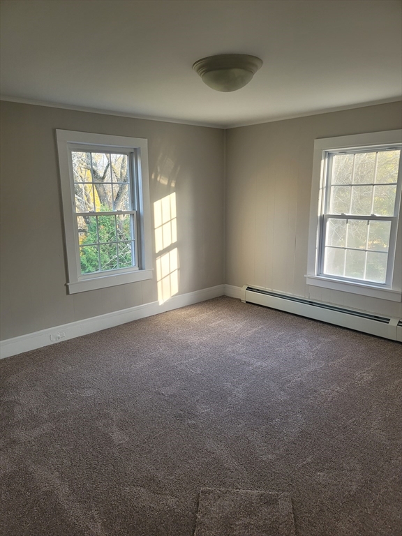 45 Main Street, Unit I Charlton, MA 01507 - Photo 7 of 11 an empty room with a window