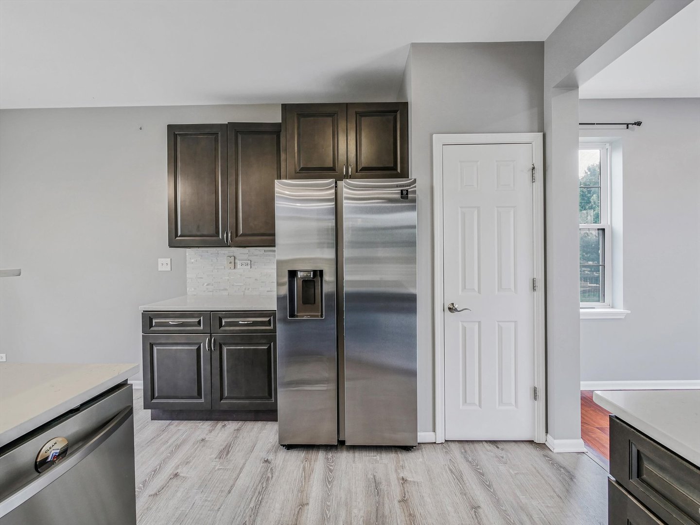 1090 Maubert Court Carol Stream, IL 60188 - Photo 15 of 55 a kitchen with a refrigerator stove and wooden cabinets