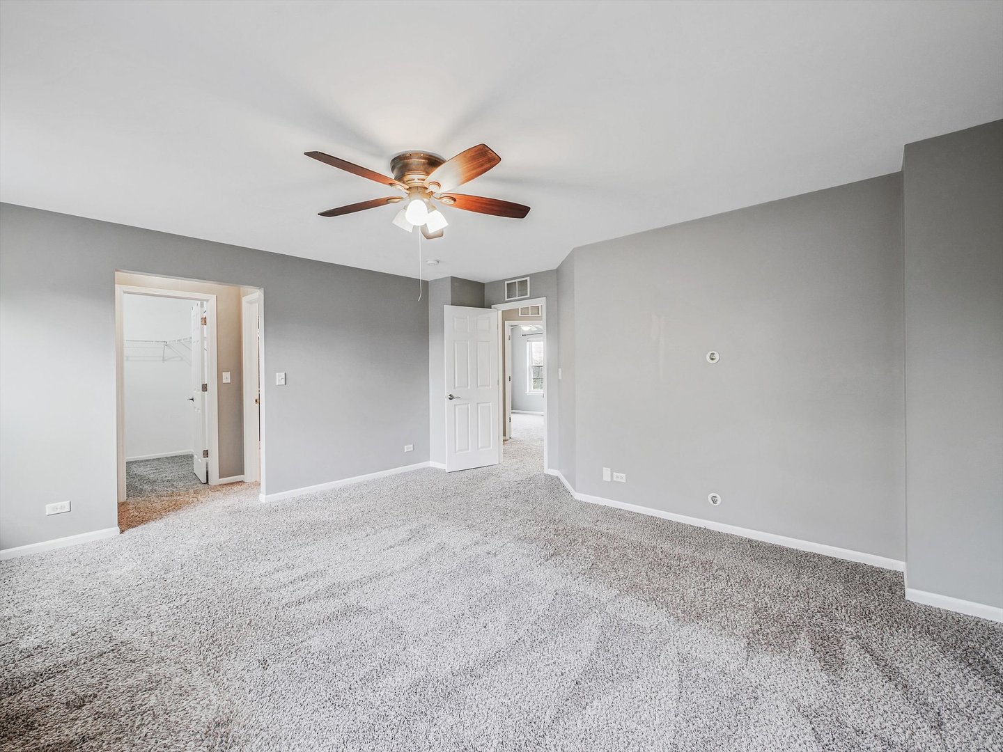 1090 Maubert Court Carol Stream, IL 60188 - Photo 29 of 55 a view of an empty room with a fan