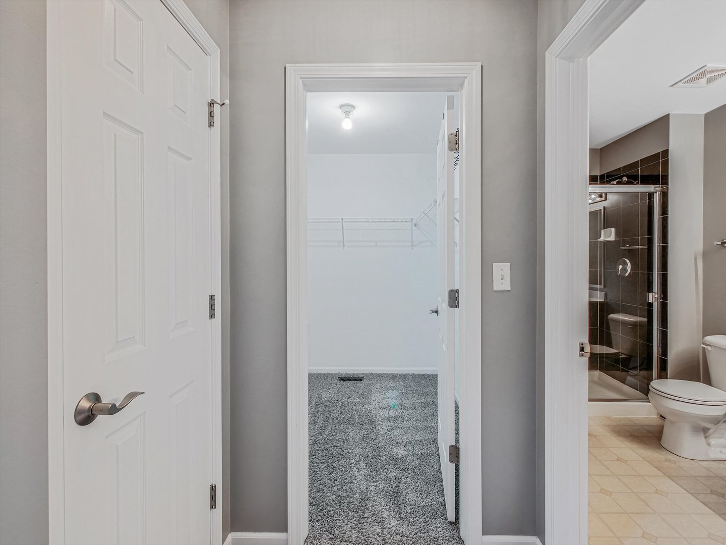 1090 Maubert Court Carol Stream, IL 60188 - Photo 30 of 55 a bathroom with a glass door shower