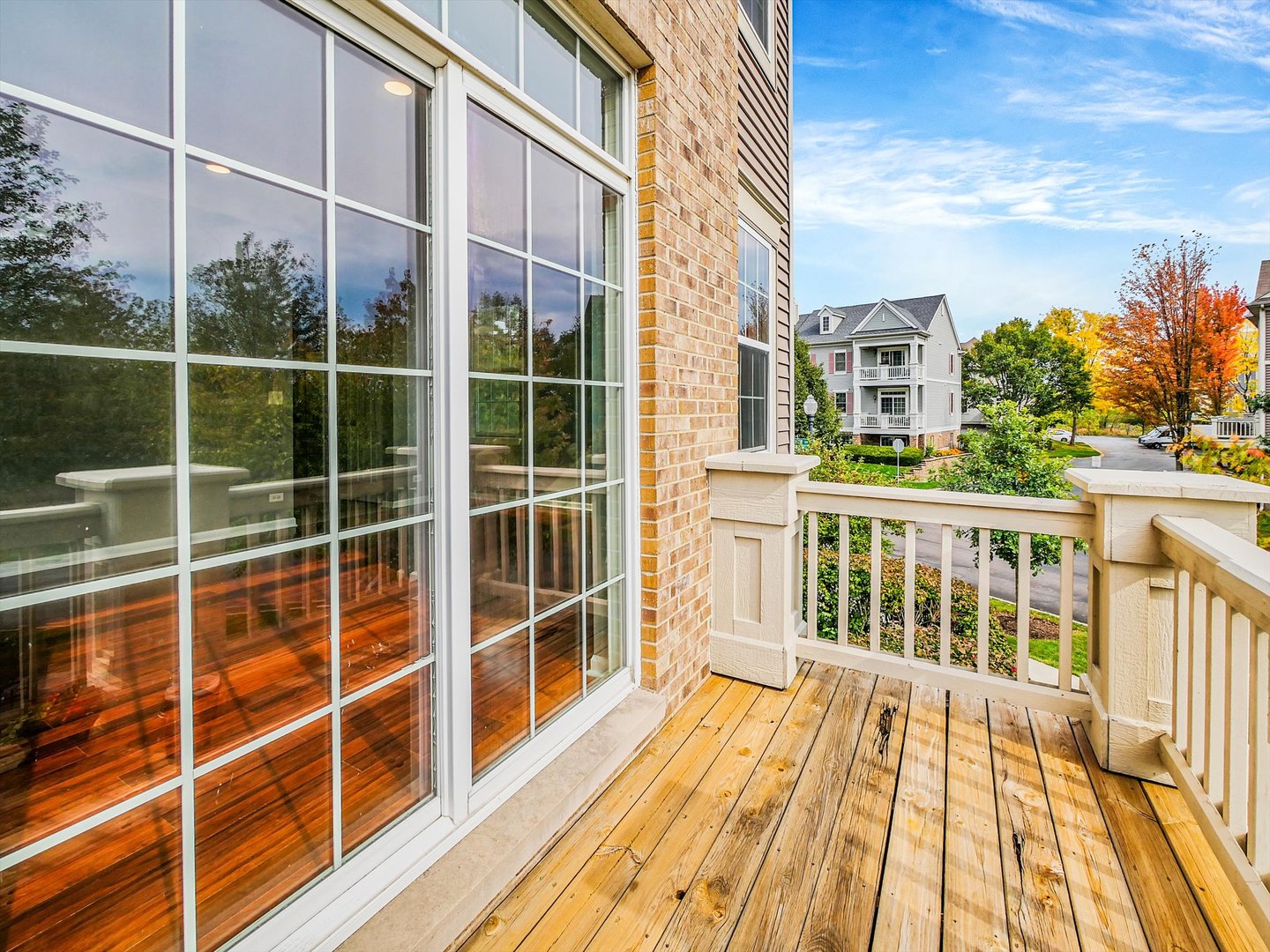 1090 Maubert Court Carol Stream, IL 60188 - Photo 42 of 55 a view of a balcony with a floor to ceiling window and wooden floor