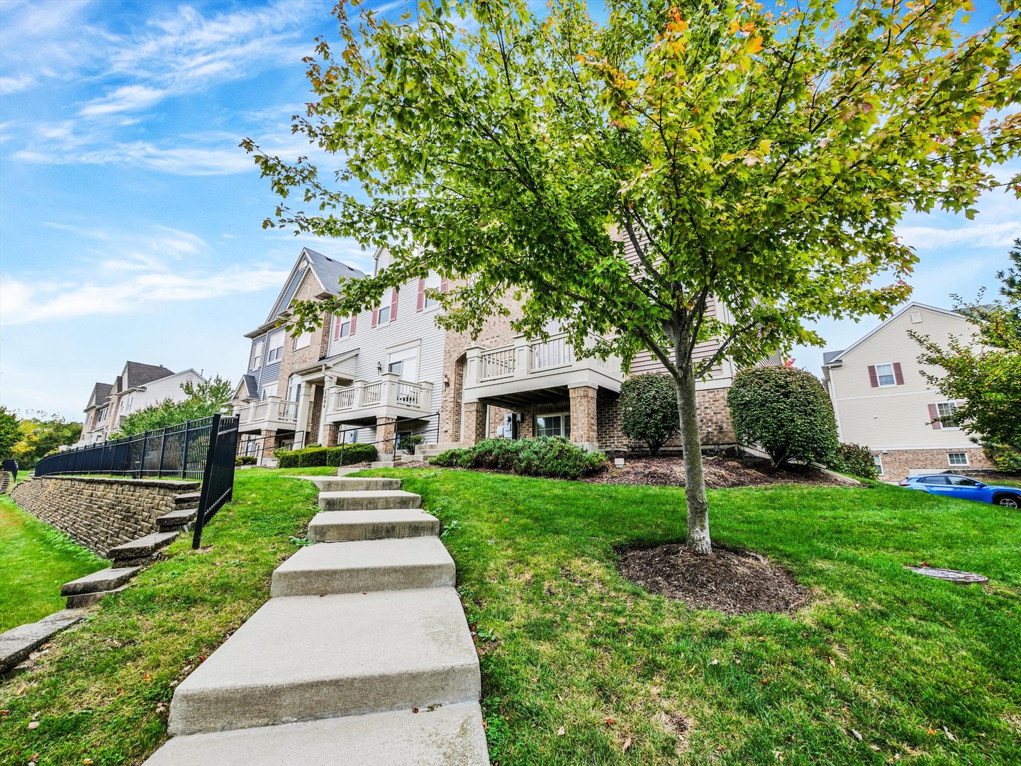 1090 Maubert Court Carol Stream, IL 60188 - Photo 48 of 55 a front view of a house with garden