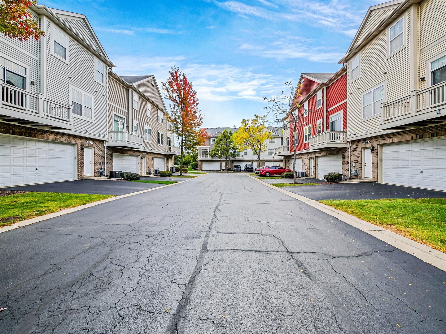 1090 Maubert Court Carol Stream, IL 60188 - Photo 50 of 55 a street view with tall buildings and a street sign