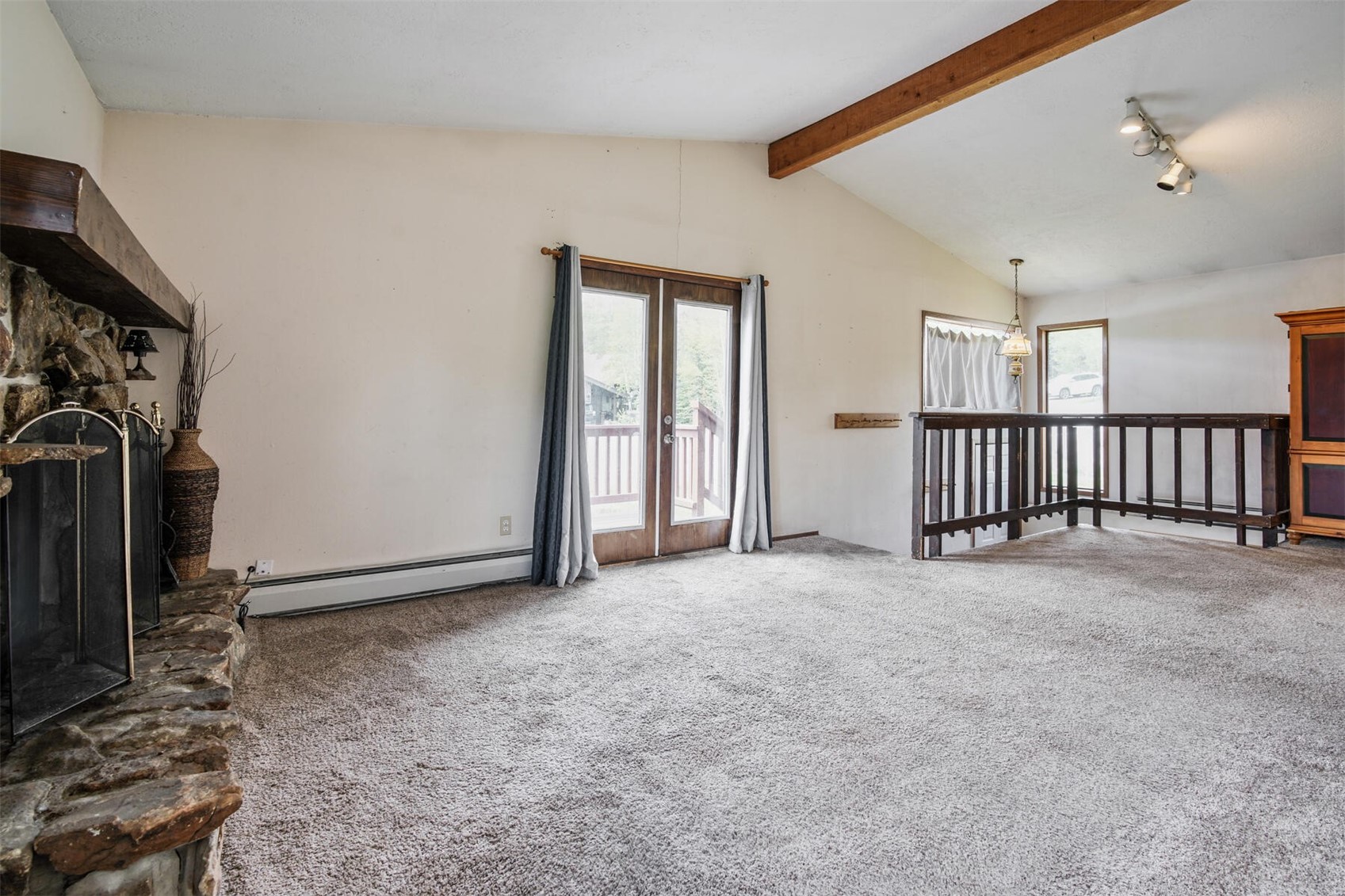 611 Ryan Gulch Road Silverthorne, CO 80498 - Photo 2 of 27 French doors lead outside to a large wrap around deck right of the living area