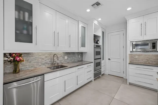 a living room with furniture rug and a fireplace