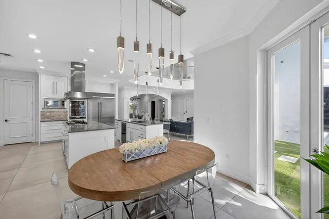 a living room with furniture and hard wood flooring