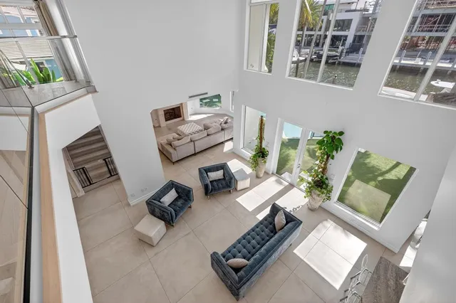 a spacious bedroom with a large bed and a wooden floor