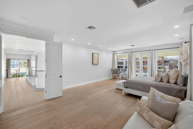 a spacious bathroom with a tub a sink and mirror