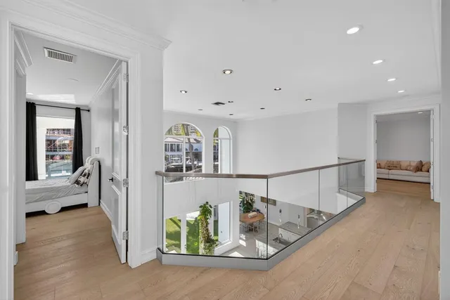 a bathroom with a sink a toilet and shower a mirror