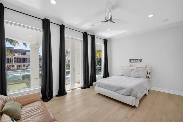 a bedroom with a bed and a potted plant