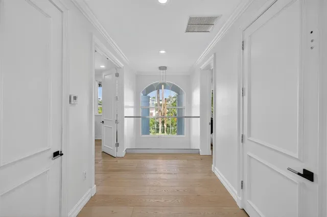 a view of an house with swimming pool and porch