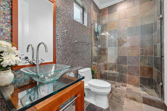 an aerial view of residential houses with outdoor space