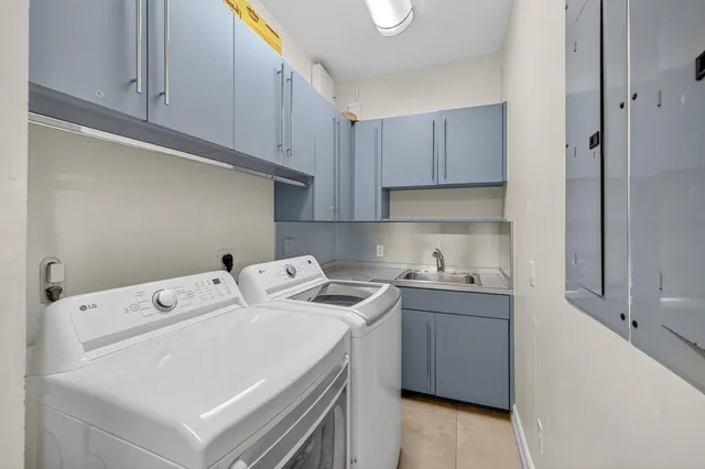 a front view of a house with a yard and a garage