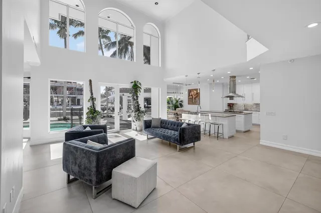 a living room with fireplace furniture and a window