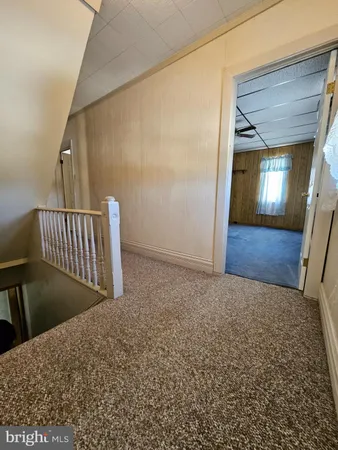 a view of a hallway and staircase