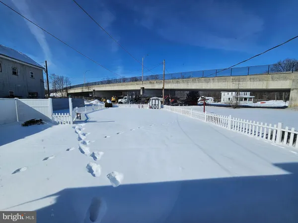 a view of a living room with kitchen