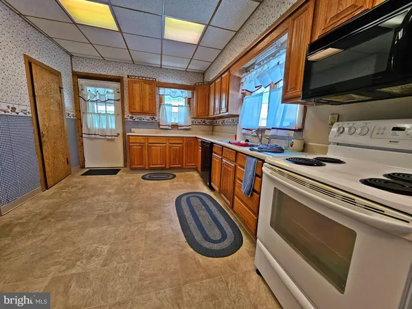 a kitchen with a stove and a microwave