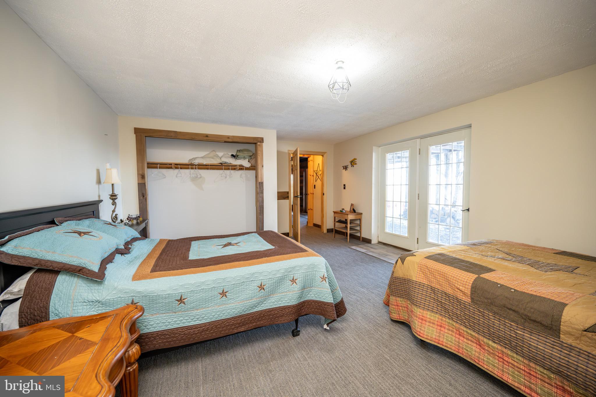 3836 Chestnut Grove Road Swanton, MD 21561 - Photo 108 of 111 a bedroom with a bed and window