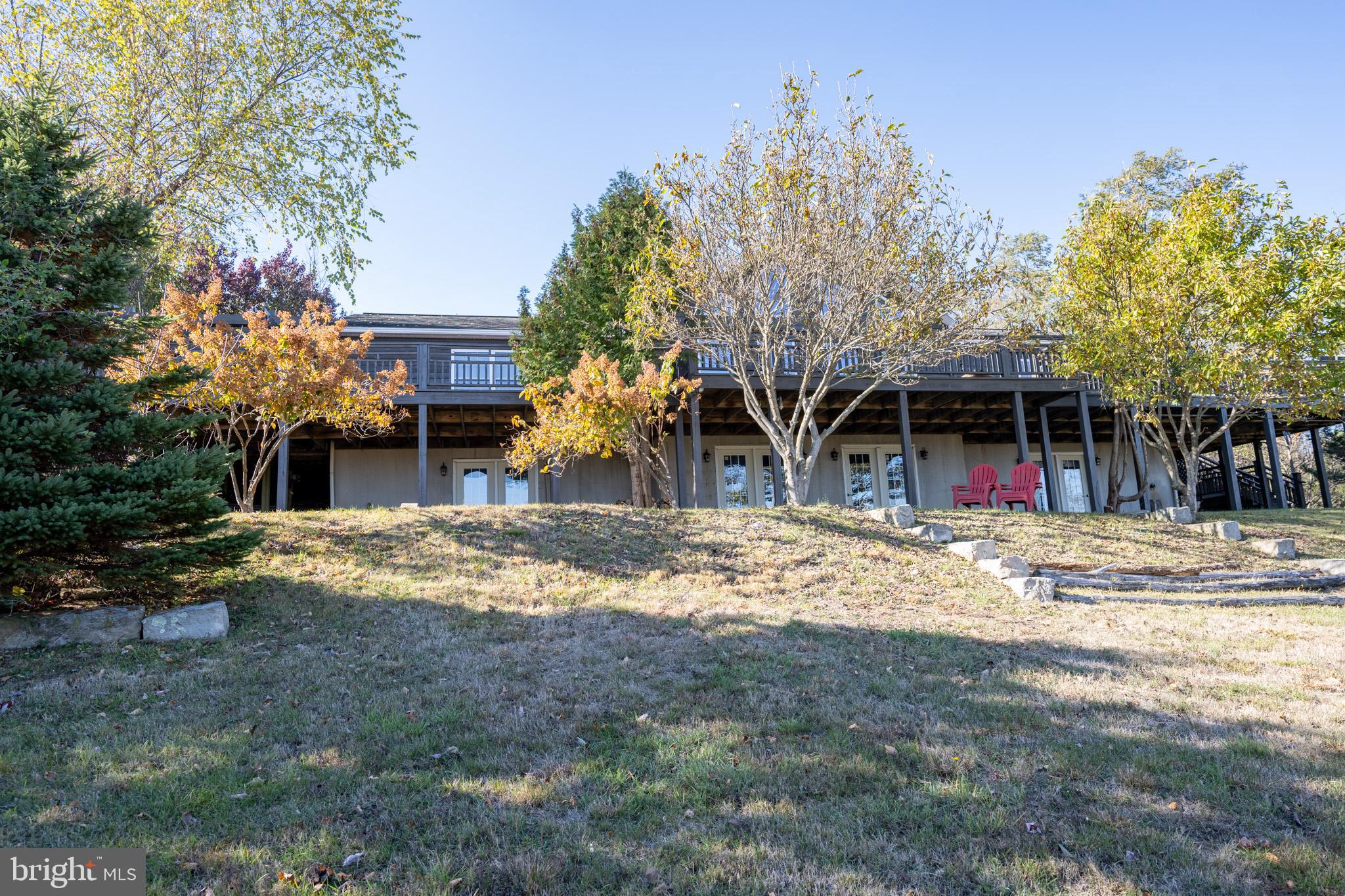 3836 Chestnut Grove Road Swanton, MD 21561 - Photo 38 of 111 a front view of a house with a yard and trees