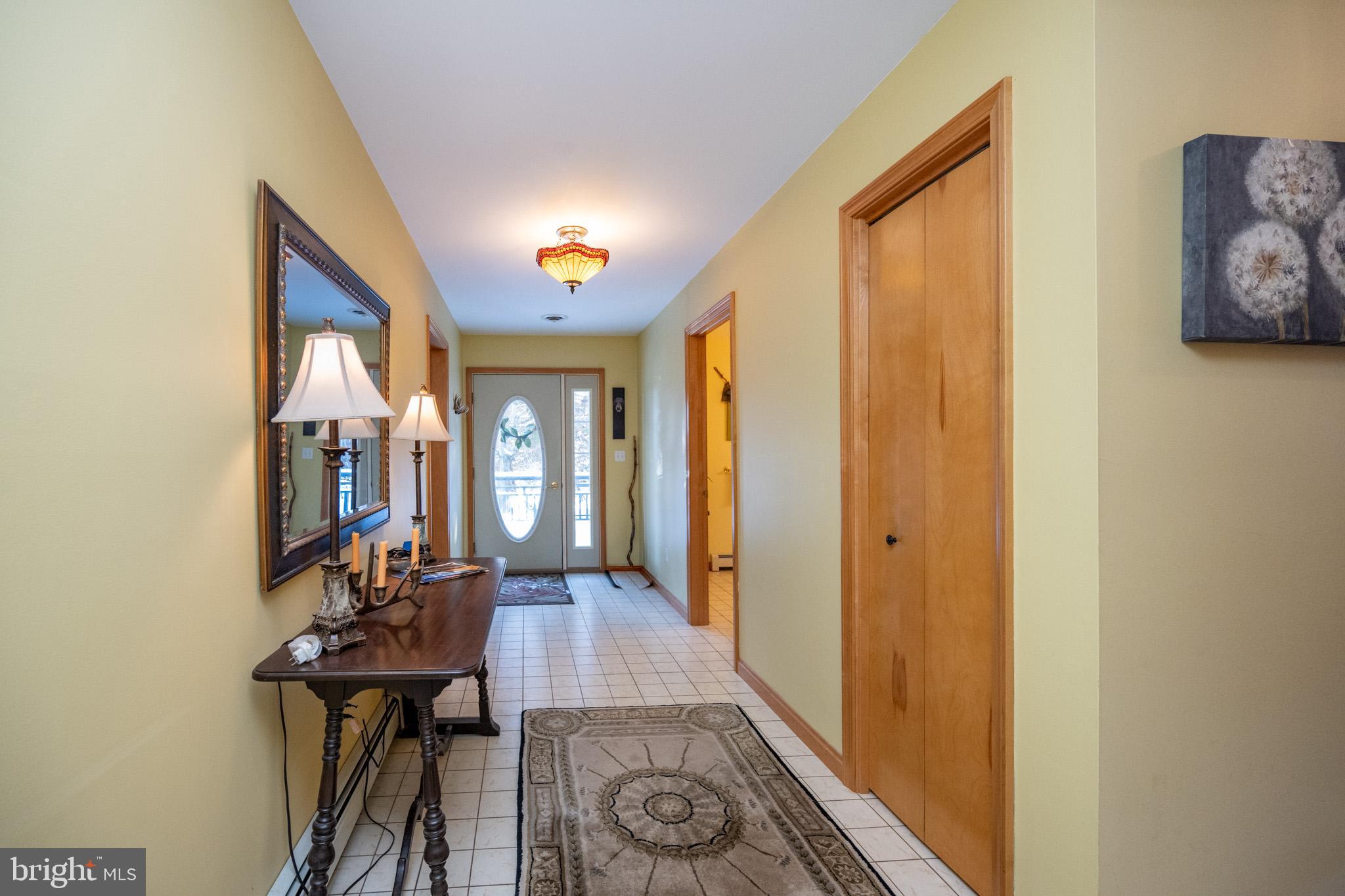3836 Chestnut Grove Road Swanton, MD 21561 - Photo 47 of 111 a view of a hallway with wooden floor and furniture