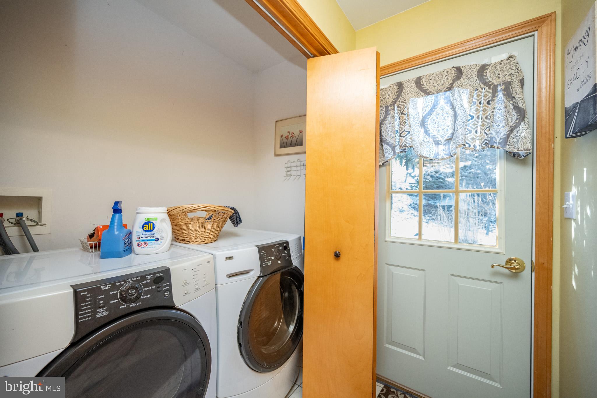 3836 Chestnut Grove Road Swanton, MD 21561 - Photo 84 of 111 a utility room with a window dryer and washer