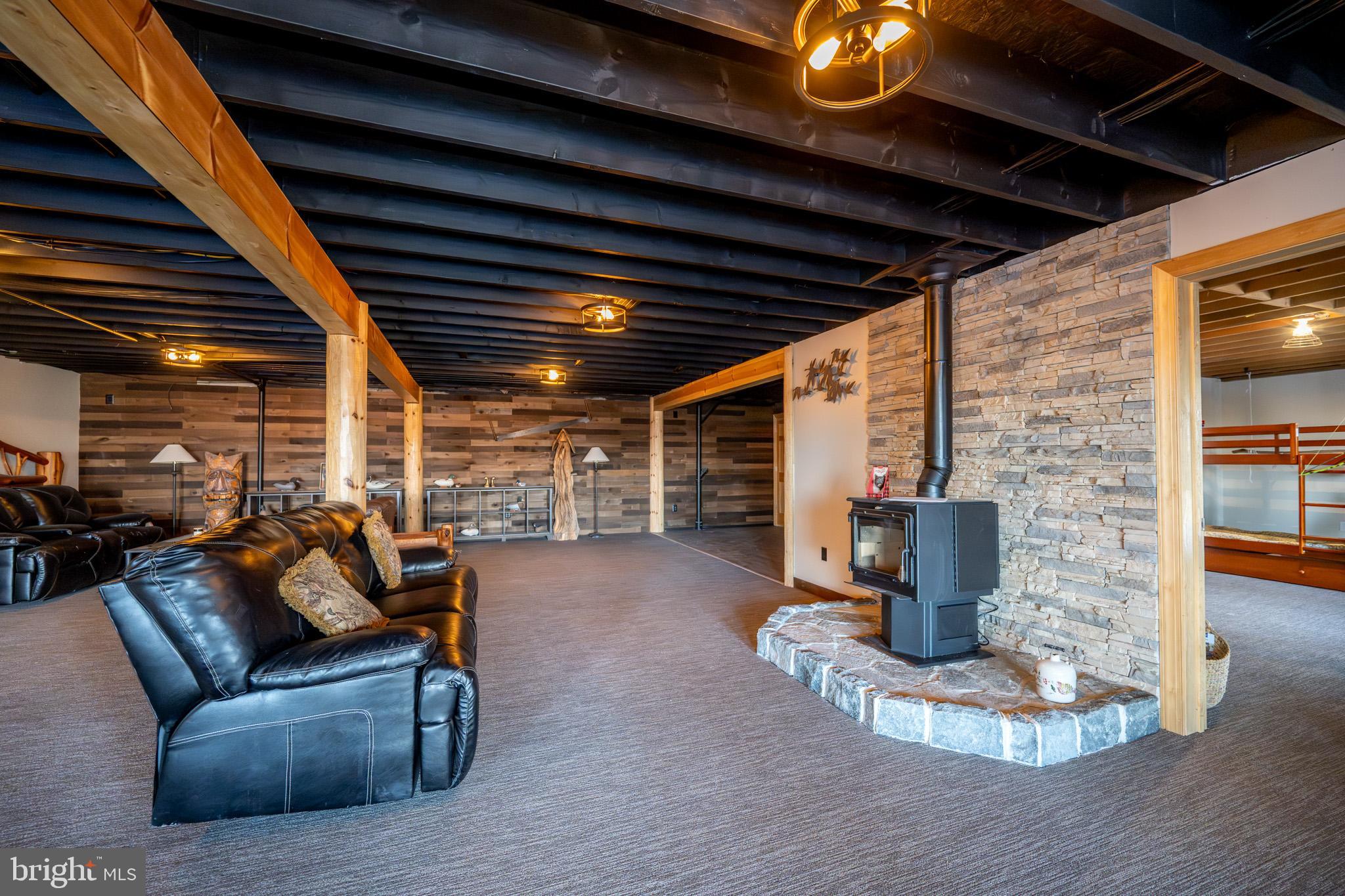 3836 Chestnut Grove Road Swanton, MD 21561 - Photo 87 of 111 a outdoor living space with patio furniture and a fireplace