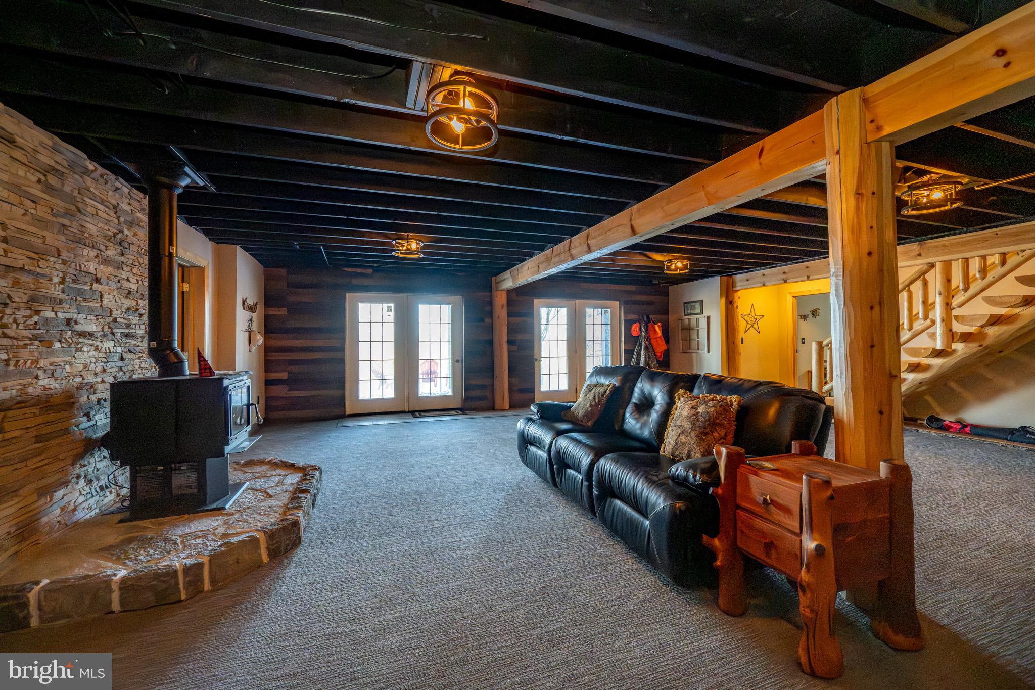 3836 Chestnut Grove Road Swanton, MD 21561 - Photo 90 of 111 a outdoor space with patio furniture and a fireplace