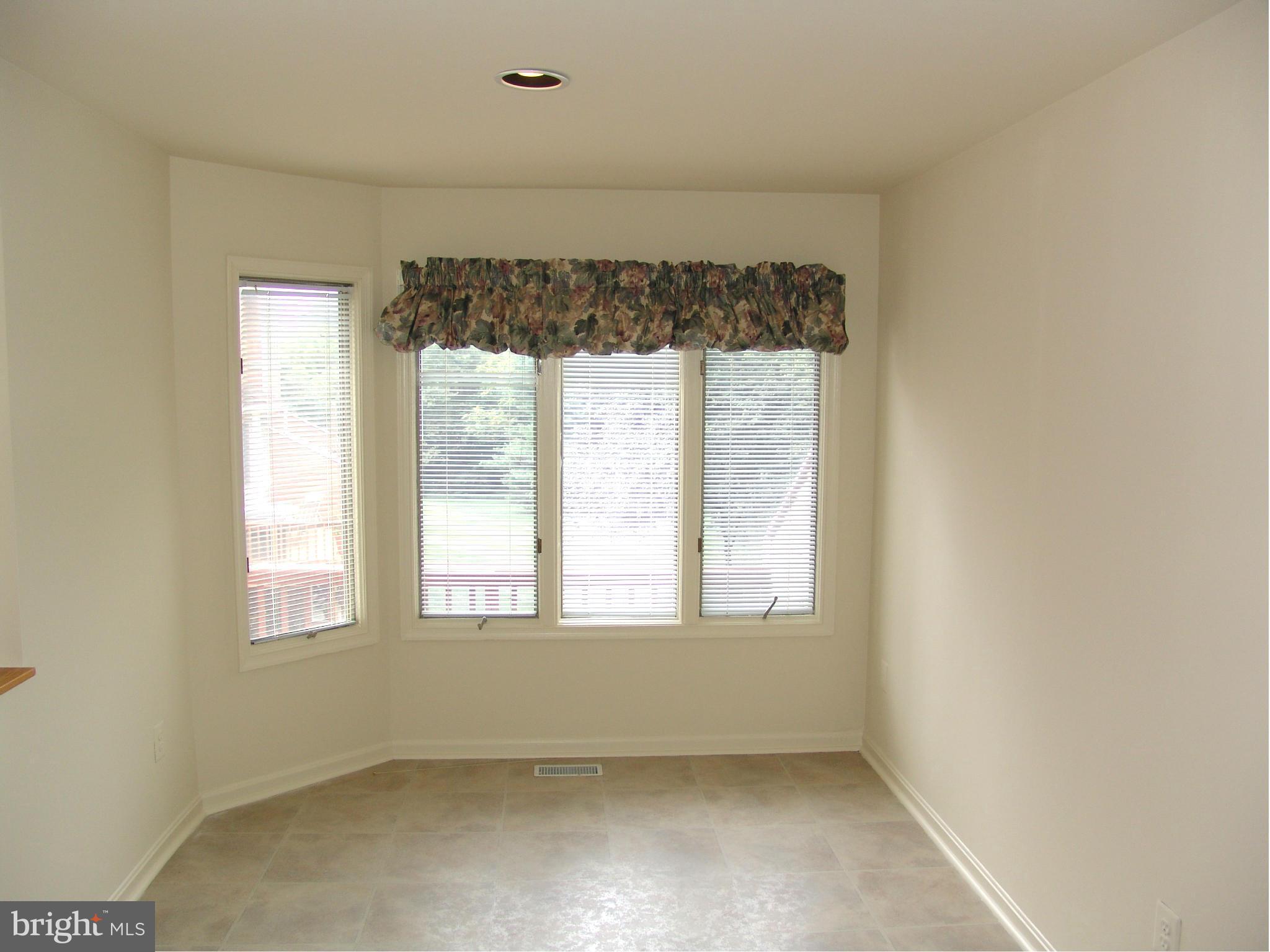 5223 Columbia Road, Unit 763 Columbia, MD 21044 - Photo 4 of 18 a view of an empty room with a window