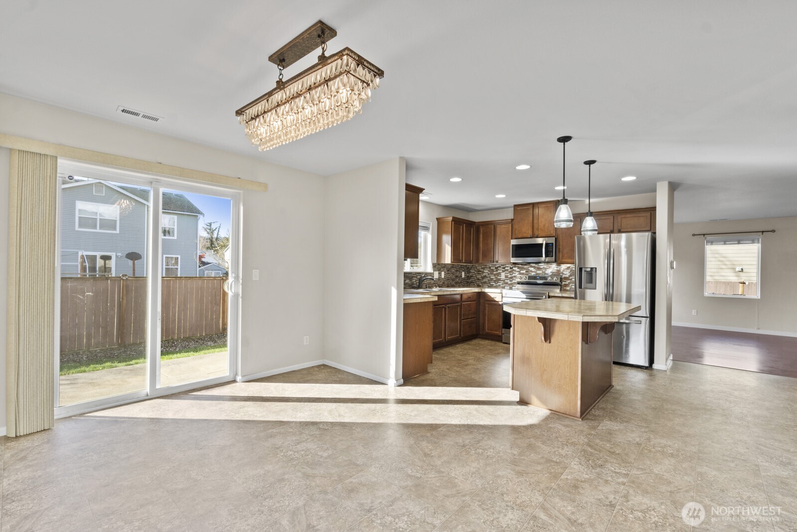 1105 Sigafoos Avenue Northwest Orting, WA 98360 - Photo 15 of 40 a view of kitchen with refrigerator and window