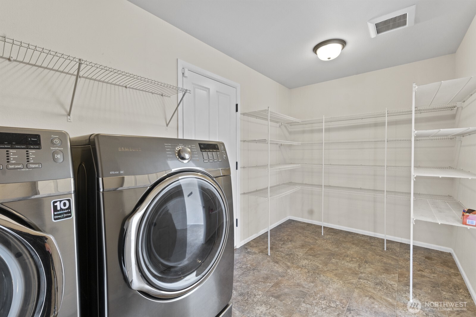 1105 Sigafoos Avenue Northwest Orting, WA 98360 - Photo 16 of 40 a utility room with dryer and washer