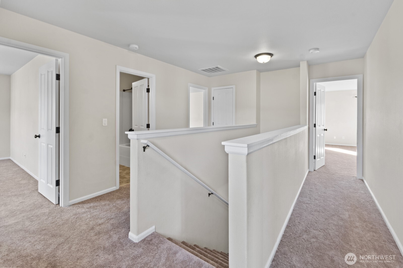 1105 Sigafoos Avenue Northwest Orting, WA 98360 - Photo 18 of 40 a view of a kitchen with white cabinets