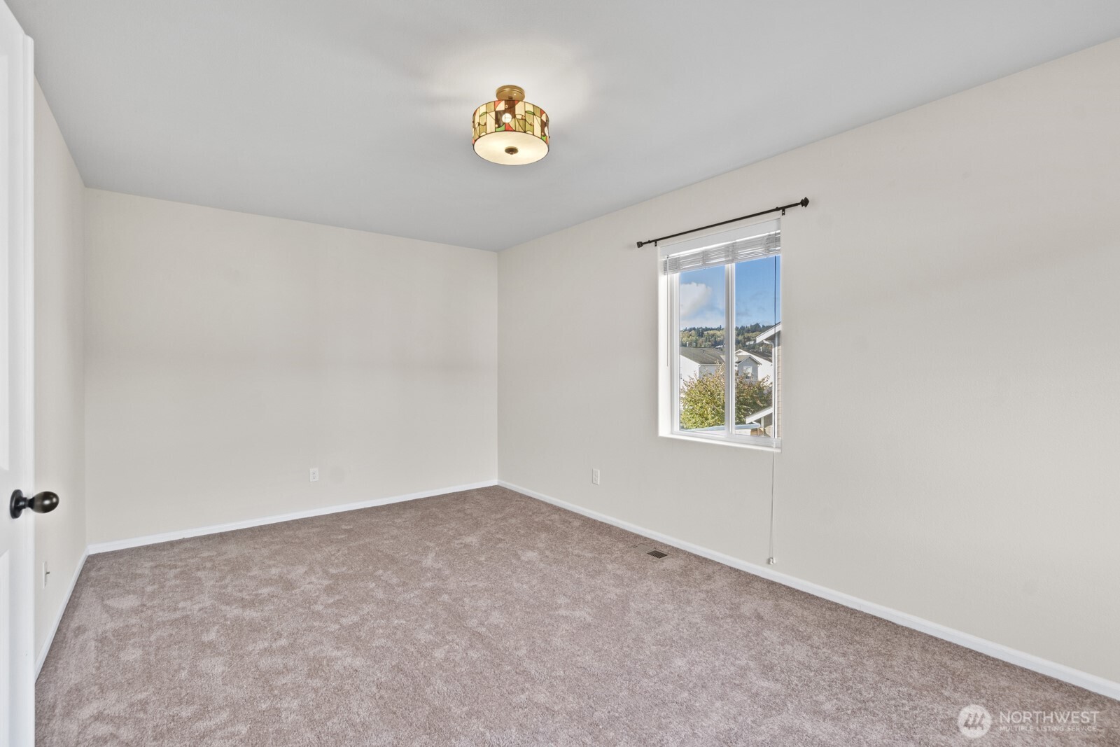 1105 Sigafoos Avenue Northwest Orting, WA 98360 - Photo 19 of 40 an empty room with a window