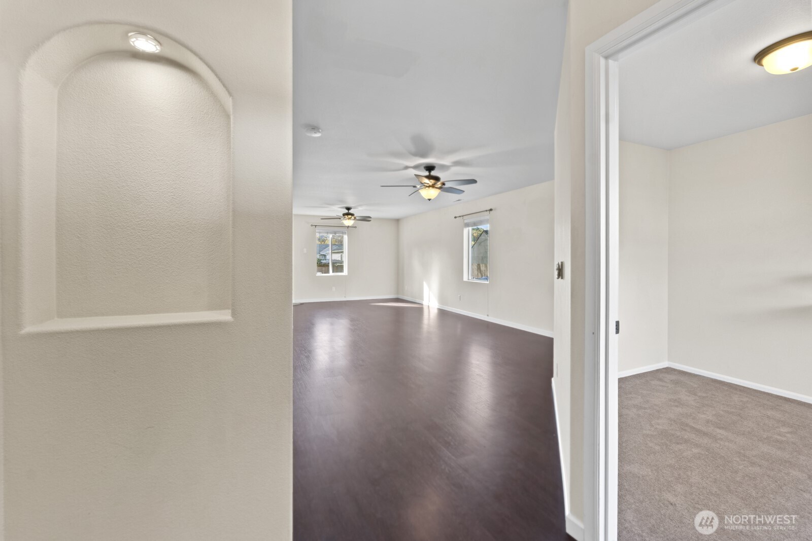 1105 Sigafoos Avenue Northwest Orting, WA 98360 - Photo 3 of 40 a view of a livingroom with wooden floor
