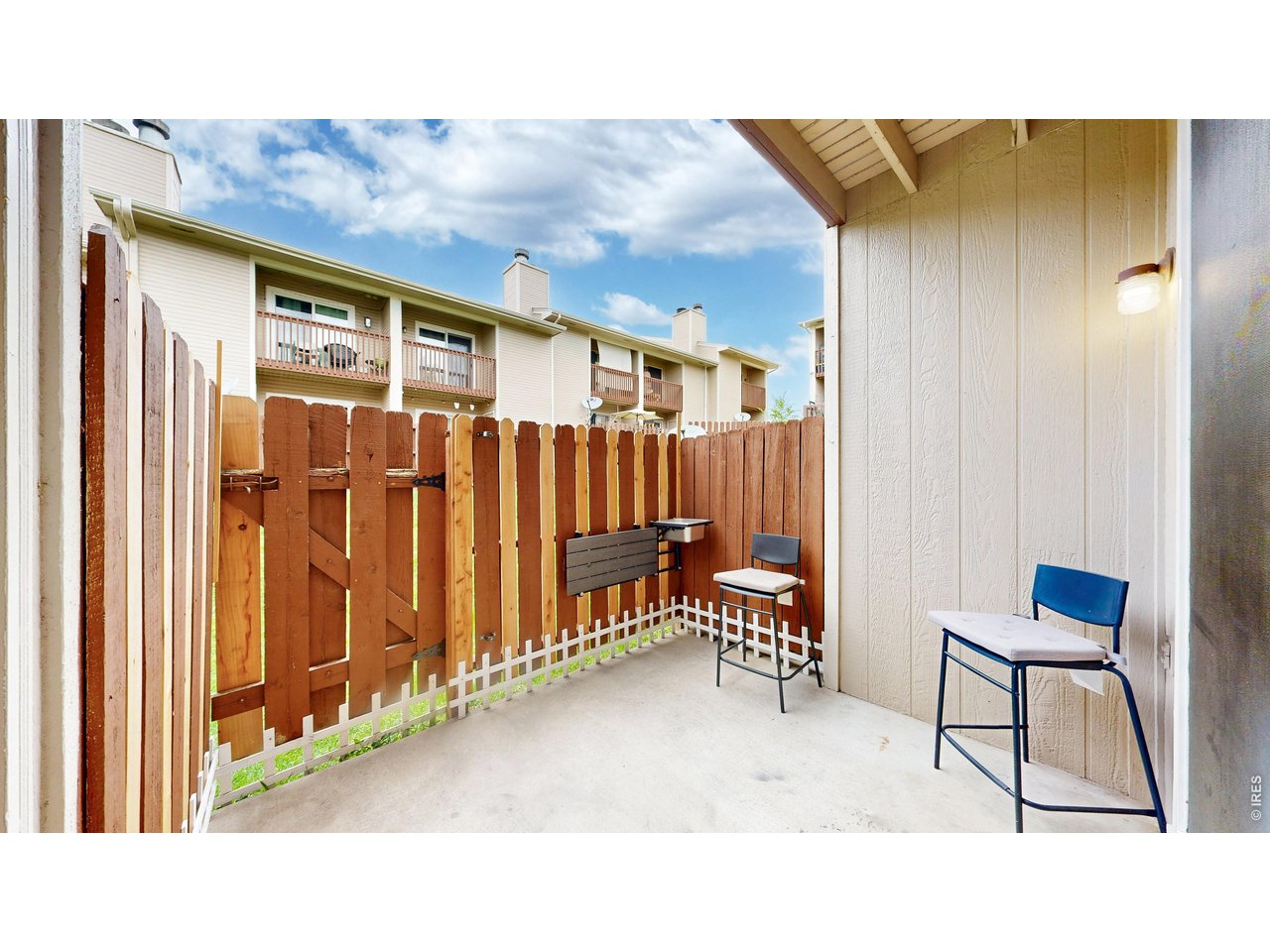 1440 Edora Road, Unit 19 Fort Collins, CO 80525 - Photo 22 of 30 Fully enclosed patio offers privacy and a bonus outdoor living space