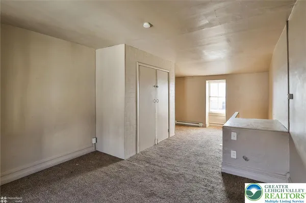 a view of an empty room and window