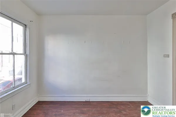 a view of an empty room and window