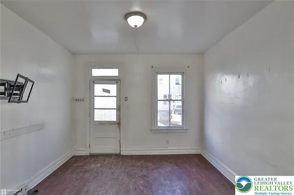 an empty room with windows