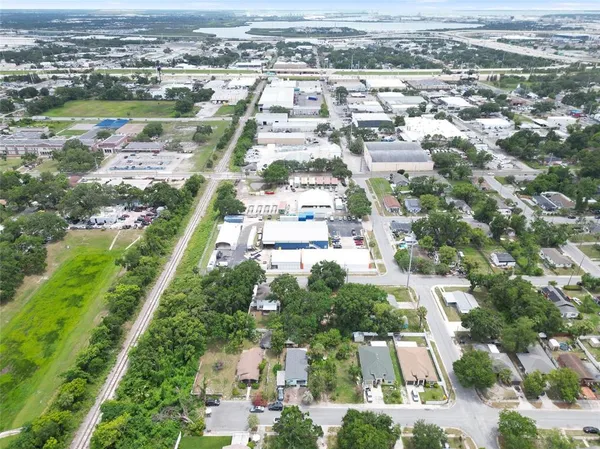 an aerial view of residential houses with outdoor space