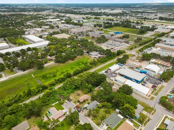 an aerial view of residential houses with outdoor space