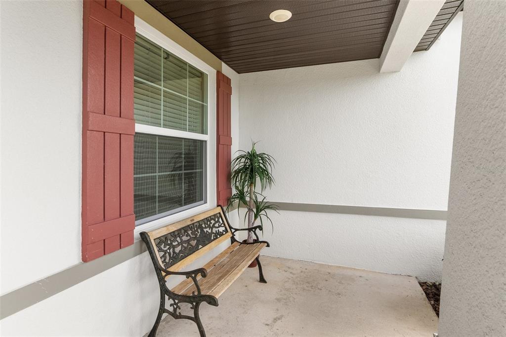 6283 Grapewood Road Spring Hill, FL 34609 - Photo 7 of 41 a view of a room with chair and wooden floor