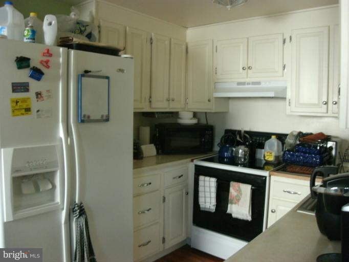 17635 Kohlhoss Road Poolesville, MD 20837 - Photo 2 of 14 a kitchen with stainless steel appliances granite countertop a refrigerator and a stove