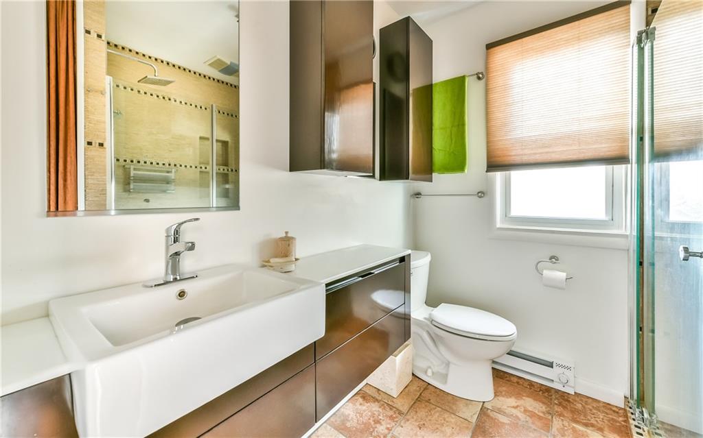 1022 Rothpletz Street Pittsburgh, PA 15212 - Photo 14 of 25 2nd floor full bath with walk-in glass shower and custom fixtures and cabinetry.