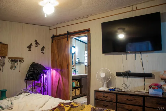 a bathroom with a toilet and a shower curtain