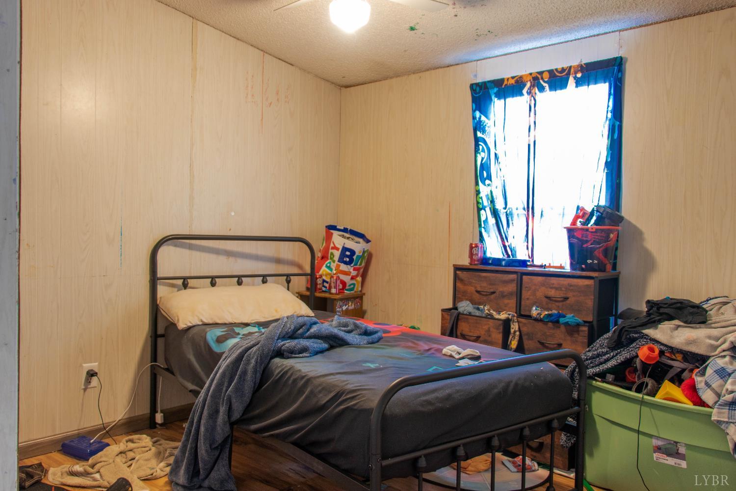 3156 Owens Mill Road Gretna, VA 24557 - Photo 21 of 31 a bedroom with a bed and a window