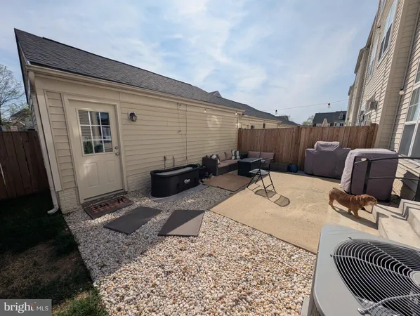 a bed room with a bed window and two mirror
