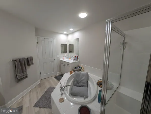 a en suite bathroom with a toilet a sink and bathtub