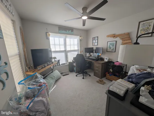 a bedroom with a workspace