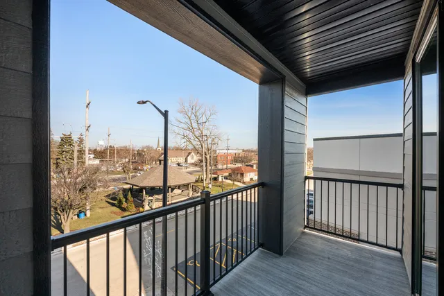 a view of a balcony with furniture