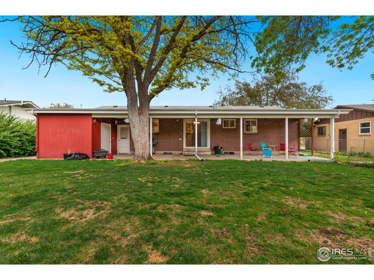1053 Montview Road Fort Collins, CO 80521 - Photo 17 of 17 Nice backyard with mature trees and covered patio