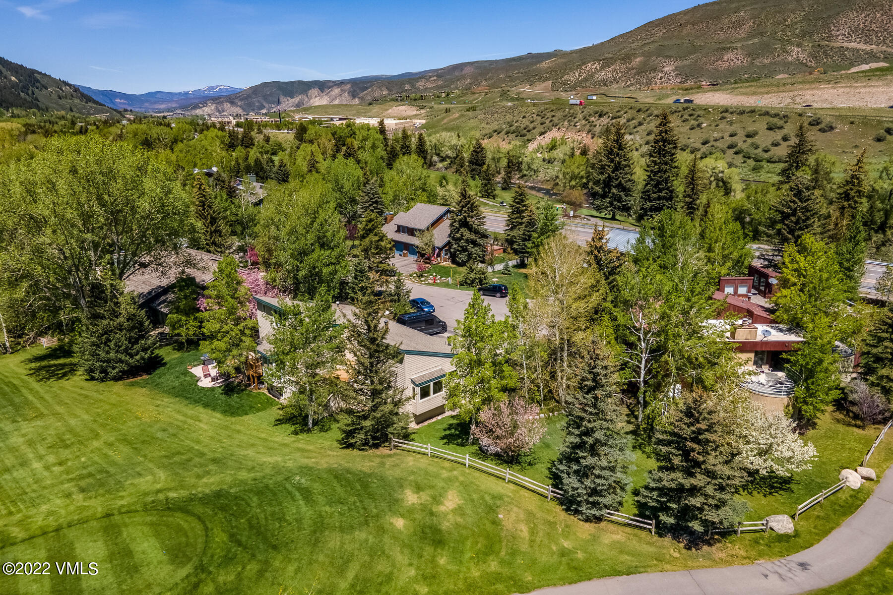 8 Deer Boulevard Eagle-Vail, CO 81620 - Photo 32 of 34 a view of a forest with mountains in the background
